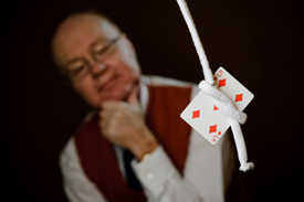 ian keable looking at card inside knotted rope